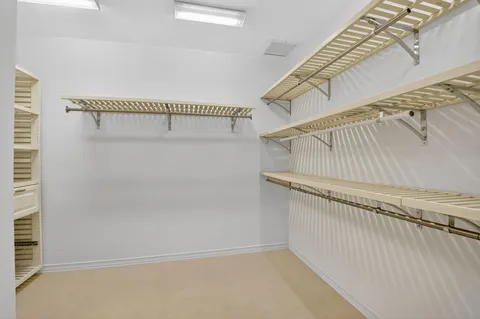 an aerial view of a house with garden space and street view