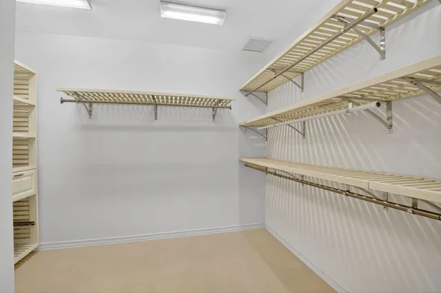 an aerial view of a house with garden space and street view