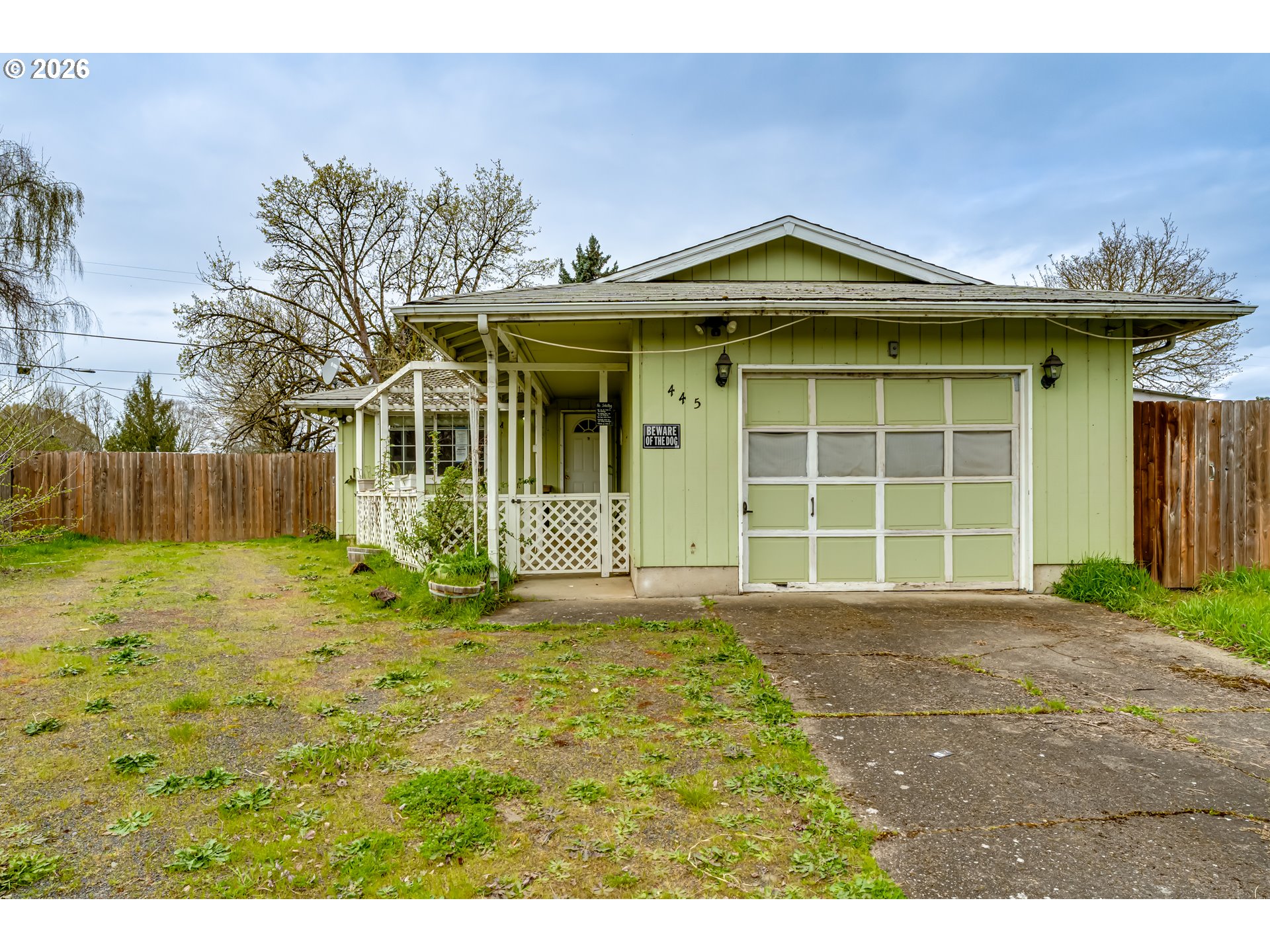 445 Southwest Juniper Street Junction City, OR 97448 - Photo 1 of 36 a view of a house with a yard and garage