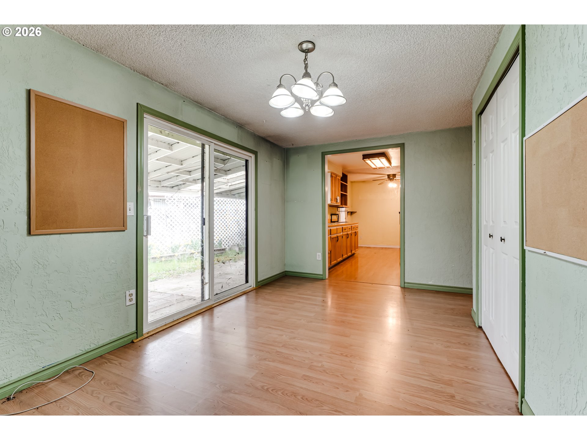 445 Southwest Juniper Street Junction City, OR 97448 - Photo 11 of 36 a view of an empty room with wooden floor and a window