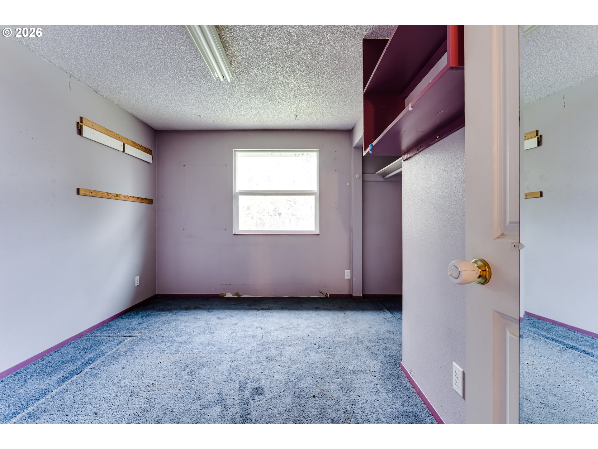445 Southwest Juniper Street Junction City, OR 97448 - Photo 12 of 36 a view of an empty room with a window