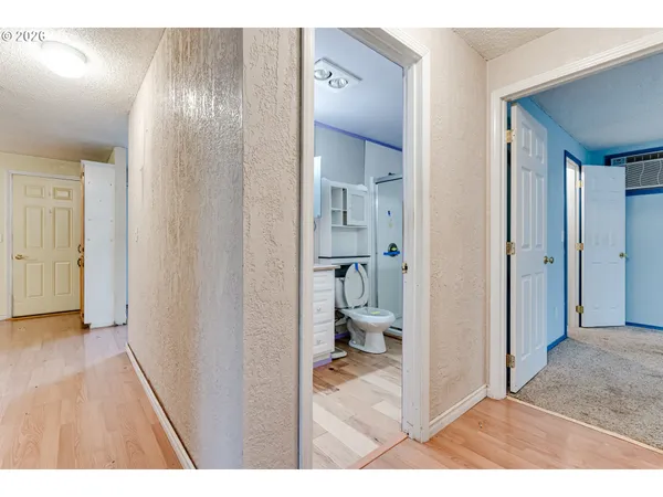 a view of a bathroom from a hallway