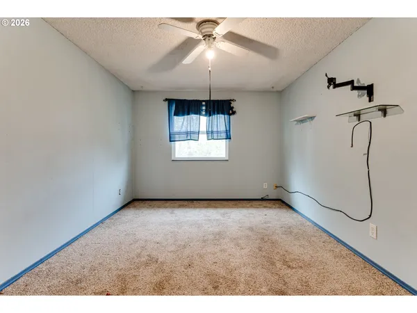 a view of an empty room with windows