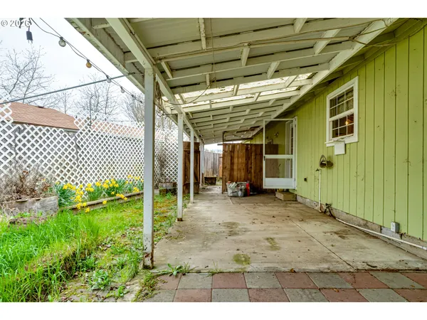 a view of a porch with wooden floor