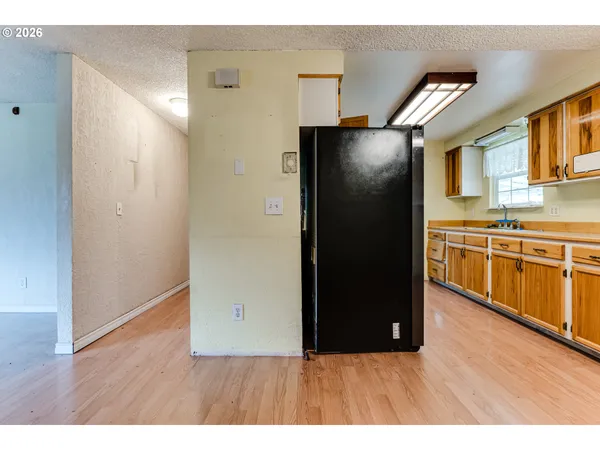 a kitchen with stainless steel appliances granite countertop a refrigerator and a stove