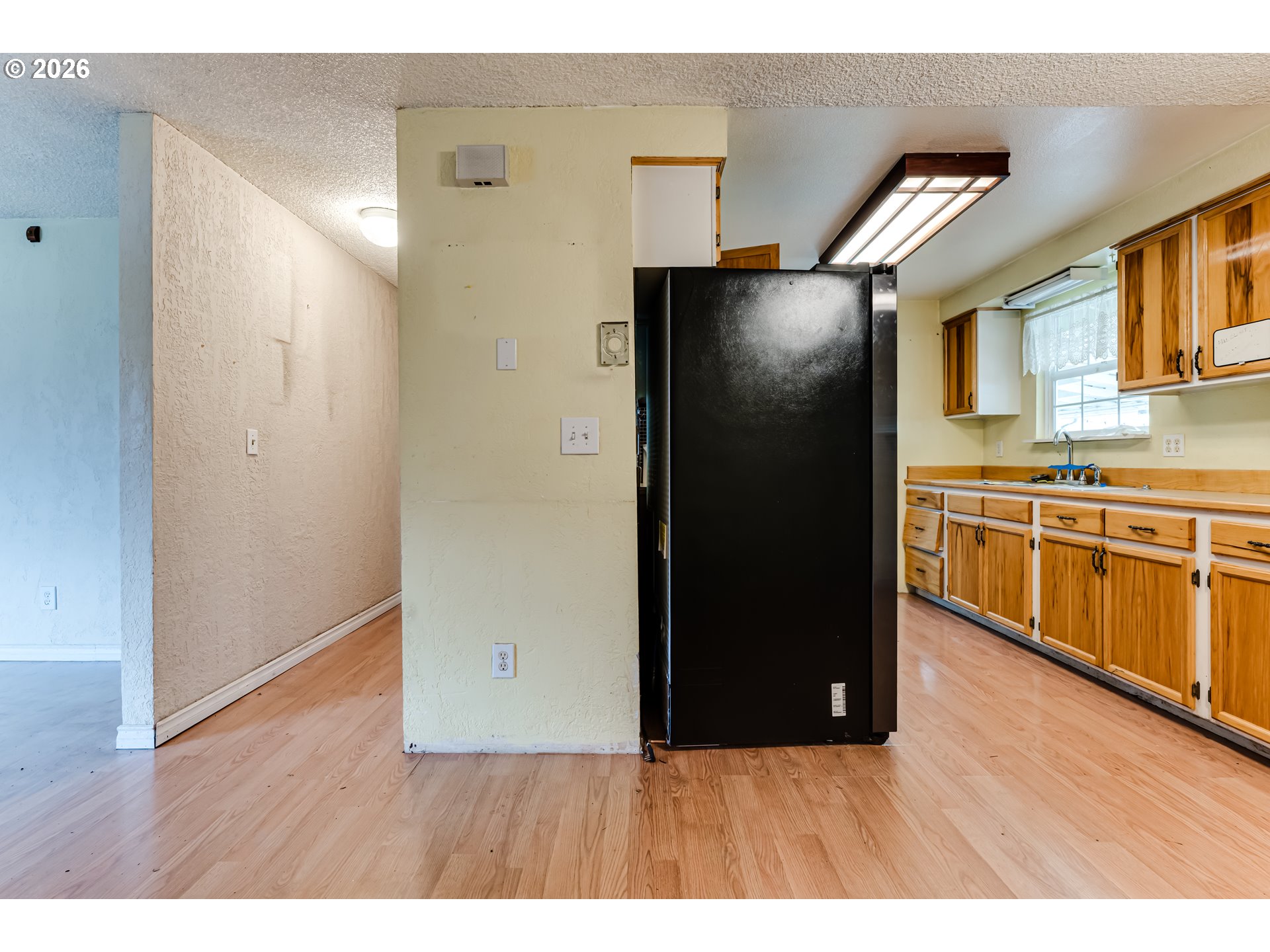 445 Southwest Juniper Street Junction City, OR 97448 - Photo 8 of 36 a kitchen with stainless steel appliances granite countertop a refrigerator and a stove
