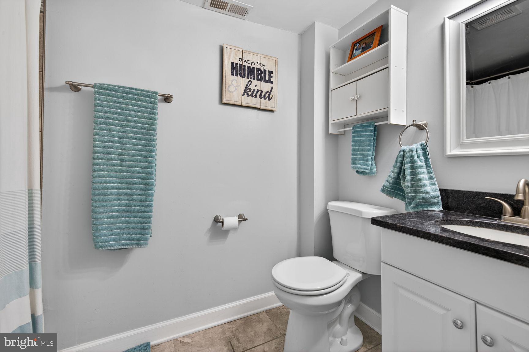 1844 Pleasant View Road Adamstown, MD 21710 - Photo 18 of 29 a bathroom with a granite countertop toilet sink and mirror