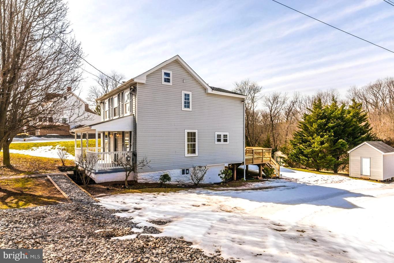 1844 Pleasant View Road Adamstown, MD 21710 - Photo 2 of 2 a front view of a house with a yard
