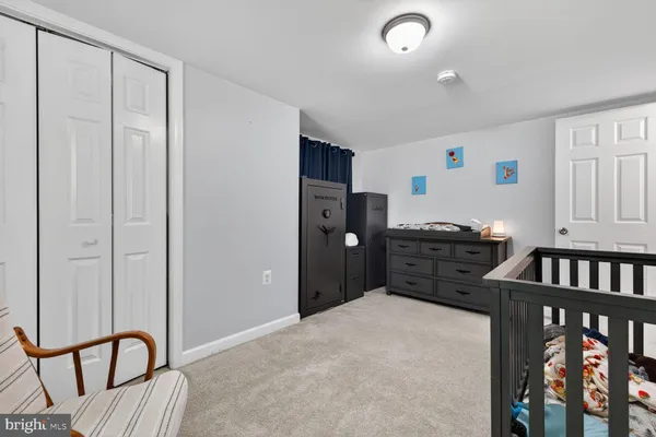 a bedroom with furniture and window