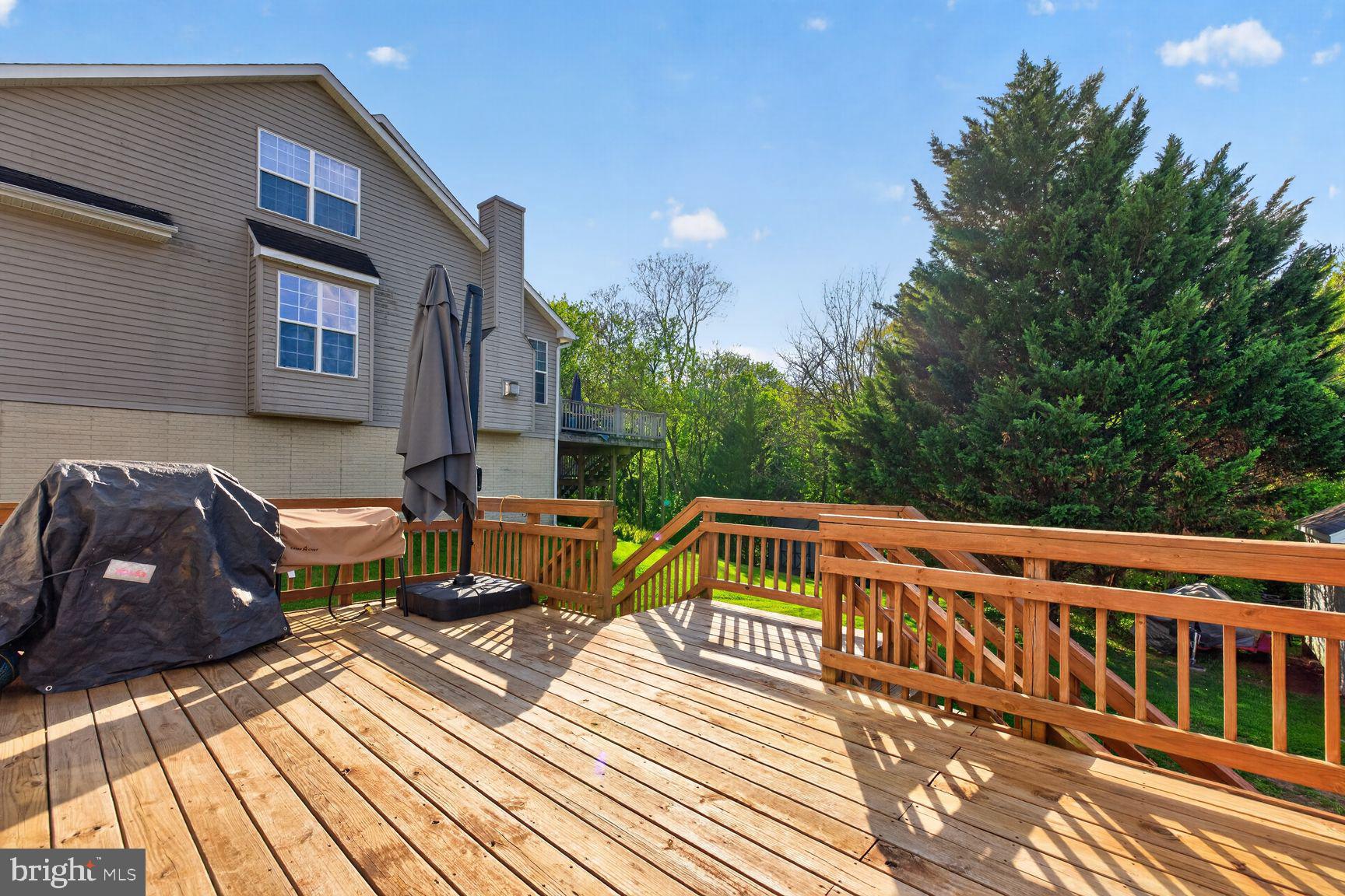 1844 Pleasant View Road Adamstown, MD 21710 - Photo 27 of 29 a view of a roof deck with couches and wooden floor