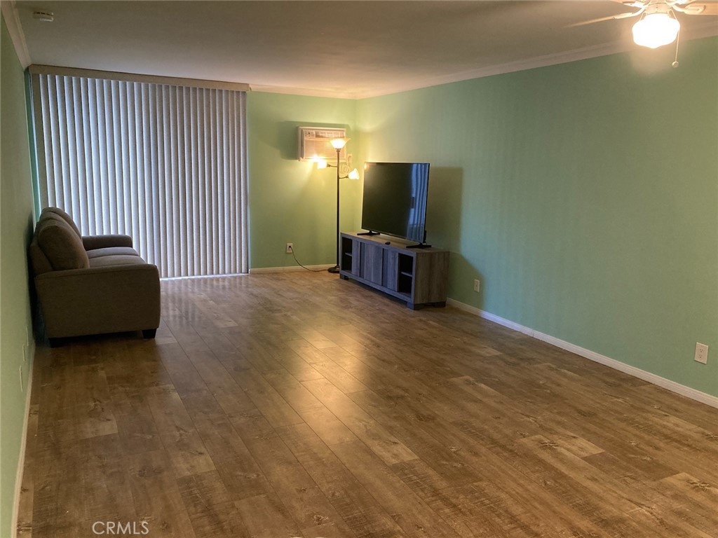4545 Collwood Boulevard, Unit 19 San Diego, CA 92115 - Photo 14 of 20 a living room with furniture and a flat screen tv