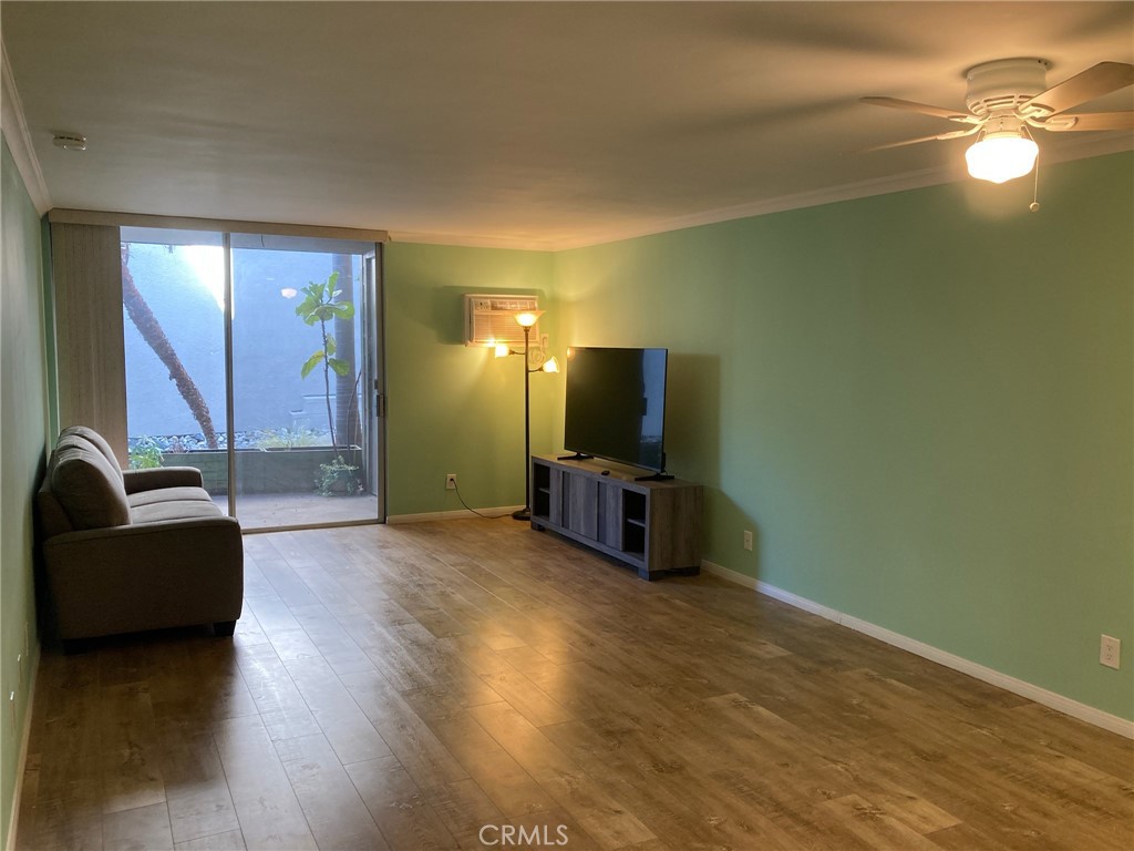4545 Collwood Boulevard, Unit 19 San Diego, CA 92115 - Photo 5 of 20 a living room with furniture and a flat screen tv