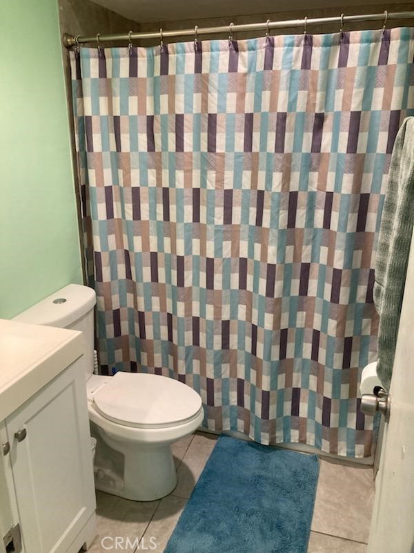 4545 Collwood Boulevard, Unit 19 San Diego, CA 92115 - Photo 9 of 20 a white toilet sitting next to a shower curtain