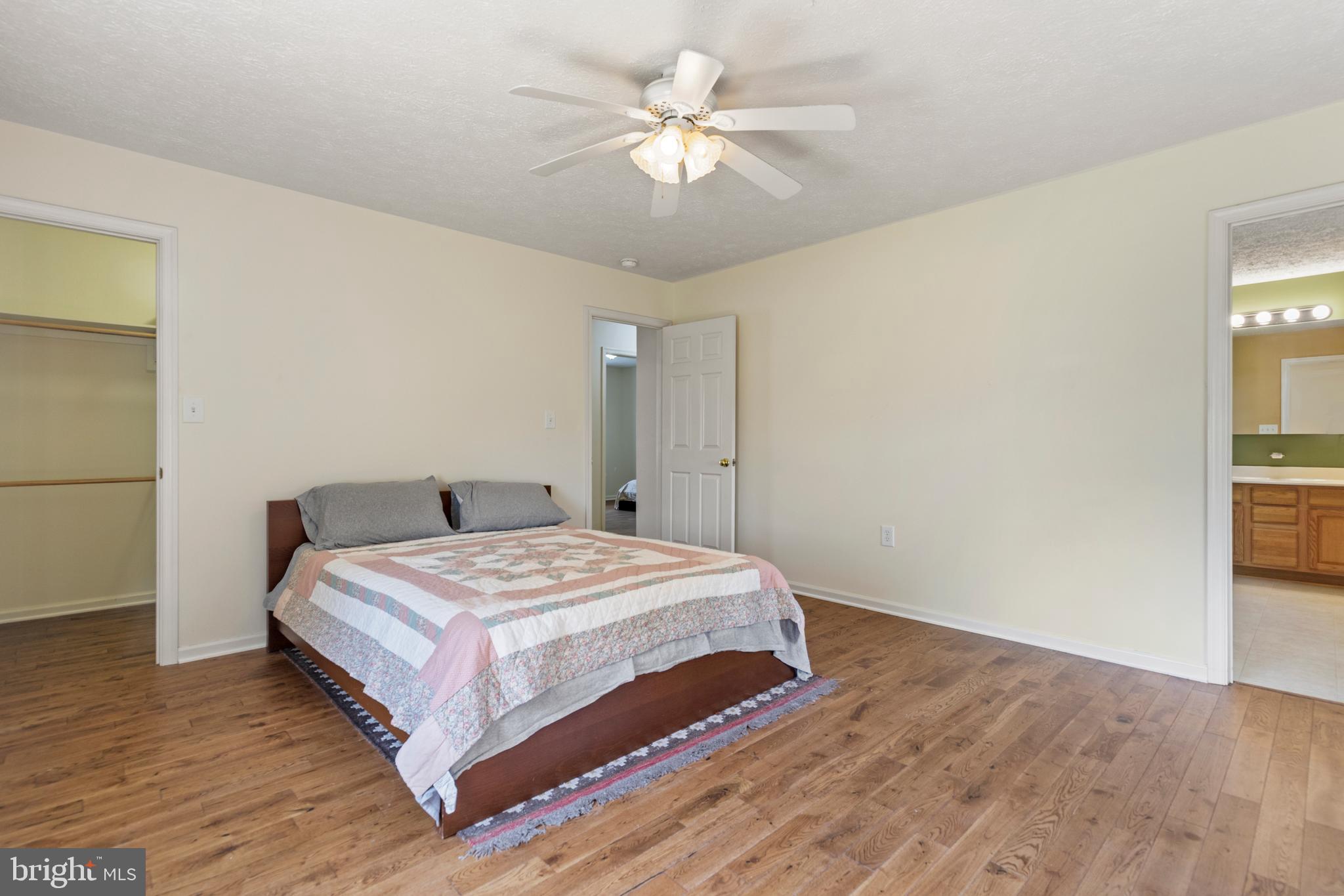 5 Hite Court Luray, VA 22835 - Photo 14 of 40 a bedroom with a bed and a chandelier