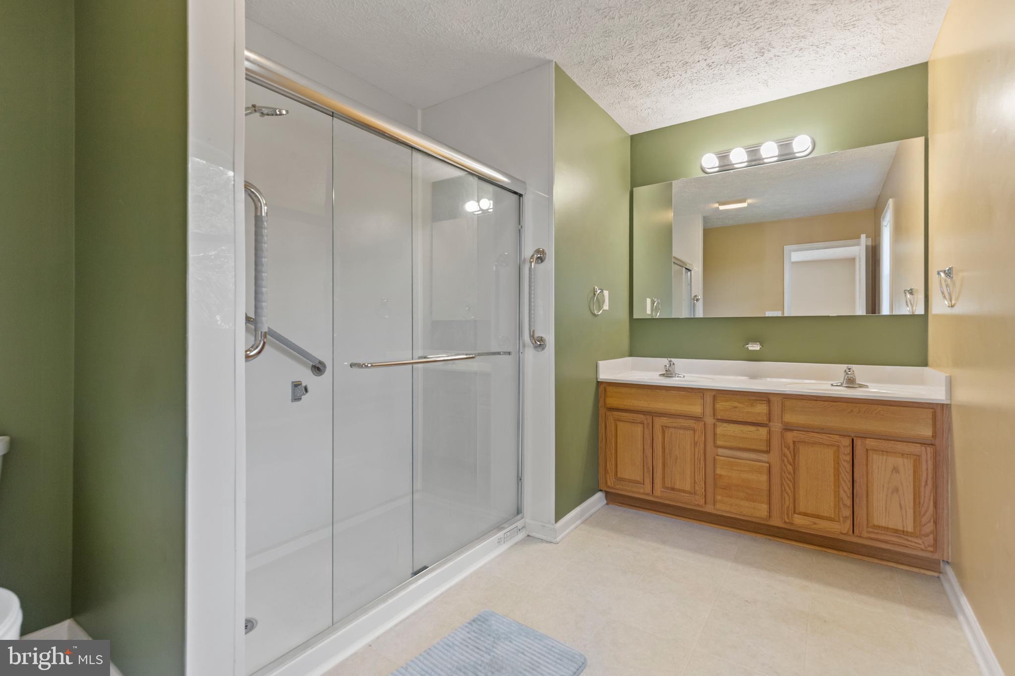 5 Hite Court Luray, VA 22835 - Photo 15 of 40 a spacious bathroom with a mirror a shower and vanity