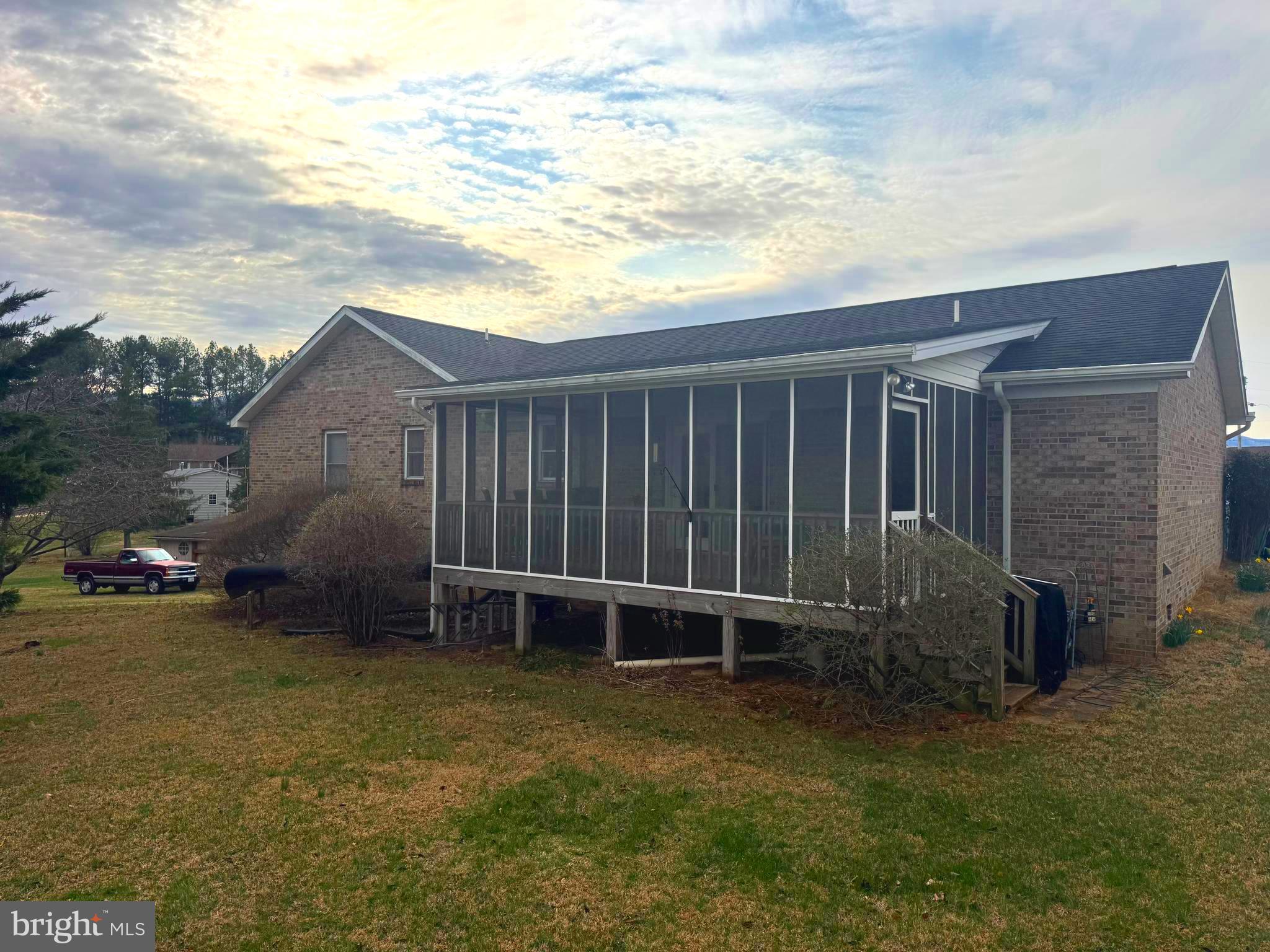 5 Hite Court Luray, VA 22835 - Photo 32 of 40 a backyard of a house with lawn chairs and iron fence