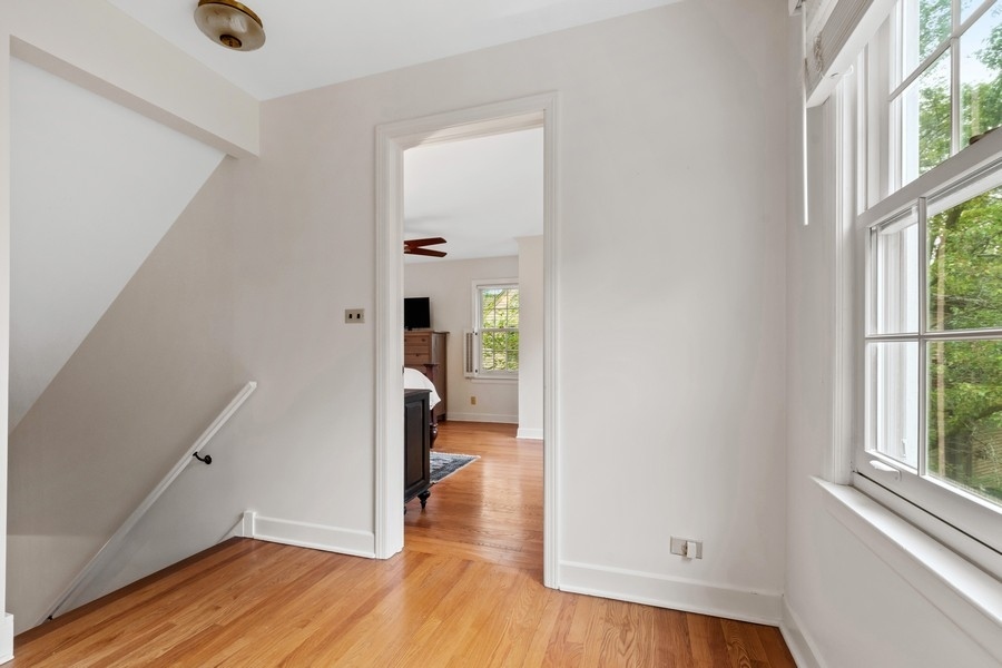 1806 Sunset Road Highland Park, IL 60035 - Photo 14 of 27 wooden floor in an empty room with a window
