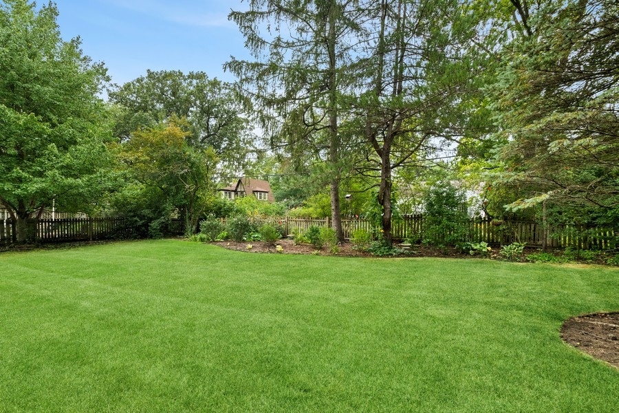 1806 Sunset Road Highland Park, IL 60035 - Photo 3 of 27 a view of a grassy field with trees