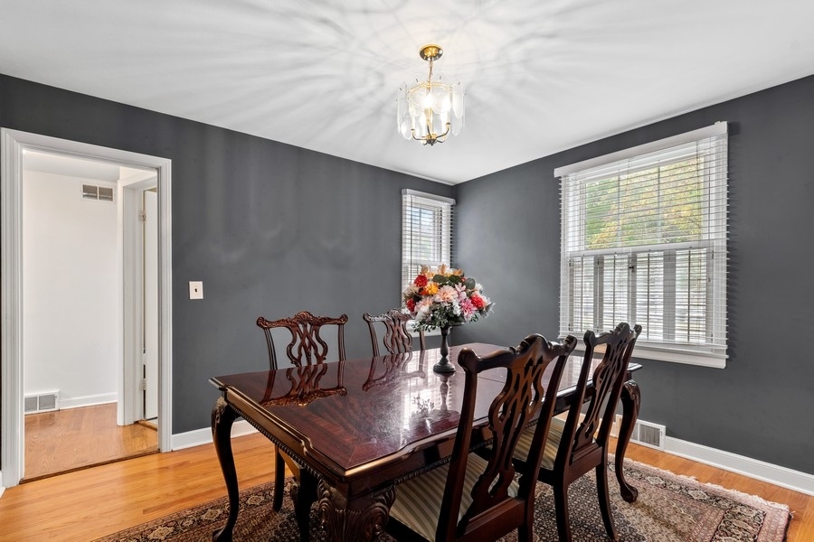 1806 Sunset Road Highland Park, IL 60035 - Photo 5 of 27 a view of a dining room with furniture and chandelier