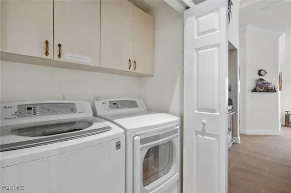 a utility room with dryer and washer
