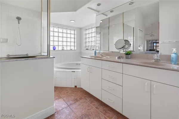 a kitchen with sink and cabinets