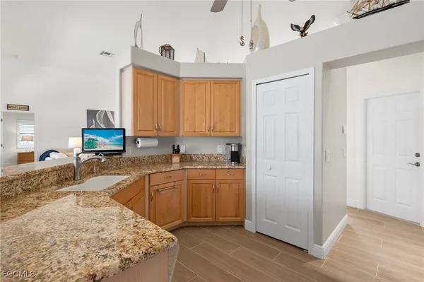 a kitchen with sink cabinets and window