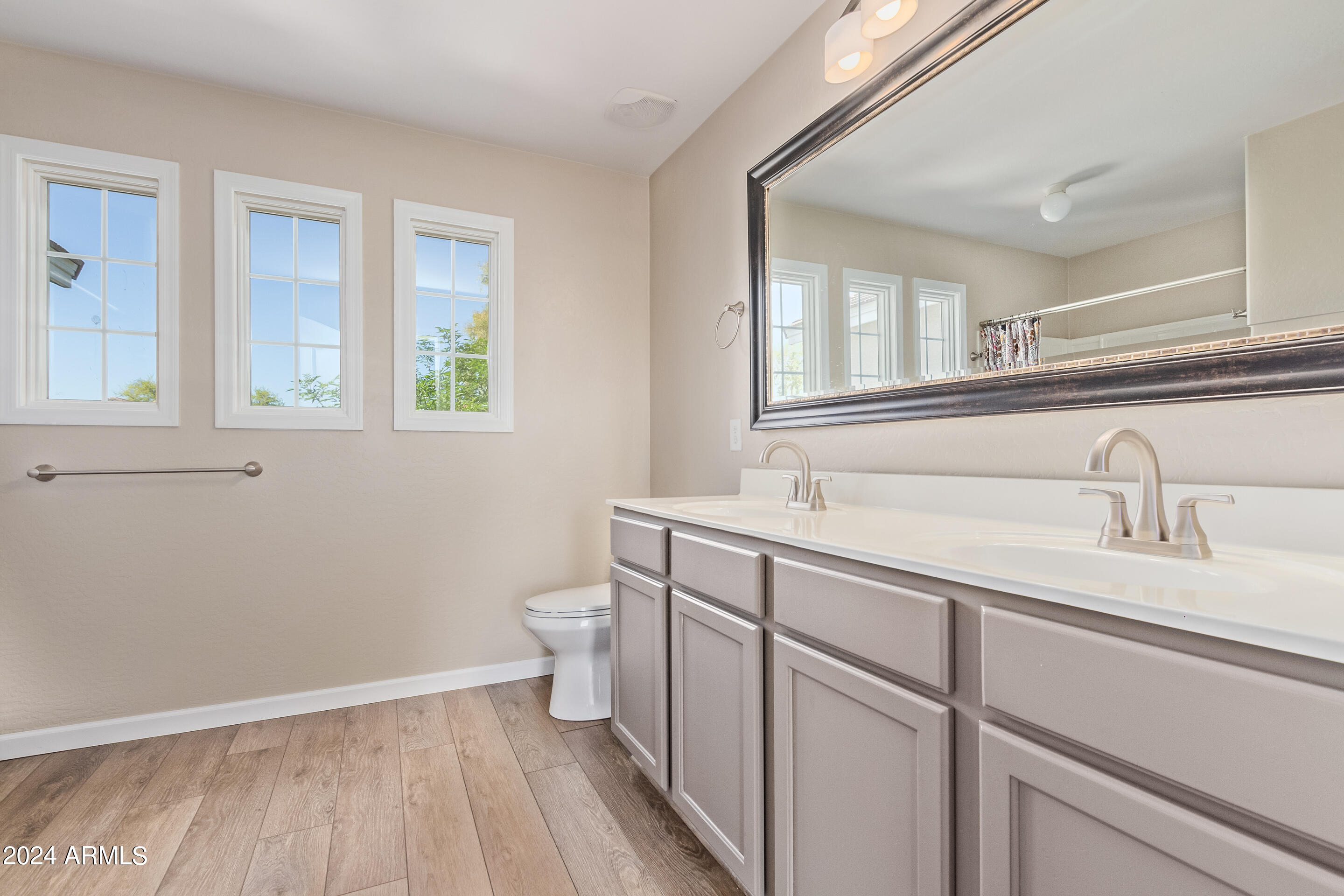 17149 West Rimrock Street Surprise, AZ 85388 - Photo 19 of 46 a bathroom with a sink and a toilet