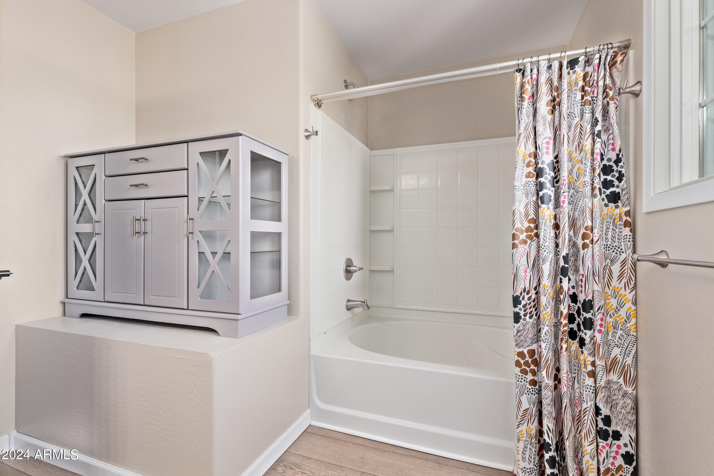 17149 West Rimrock Street Surprise, AZ 85388 - Photo 20 of 46 a bathroom with a bathtub and a shower