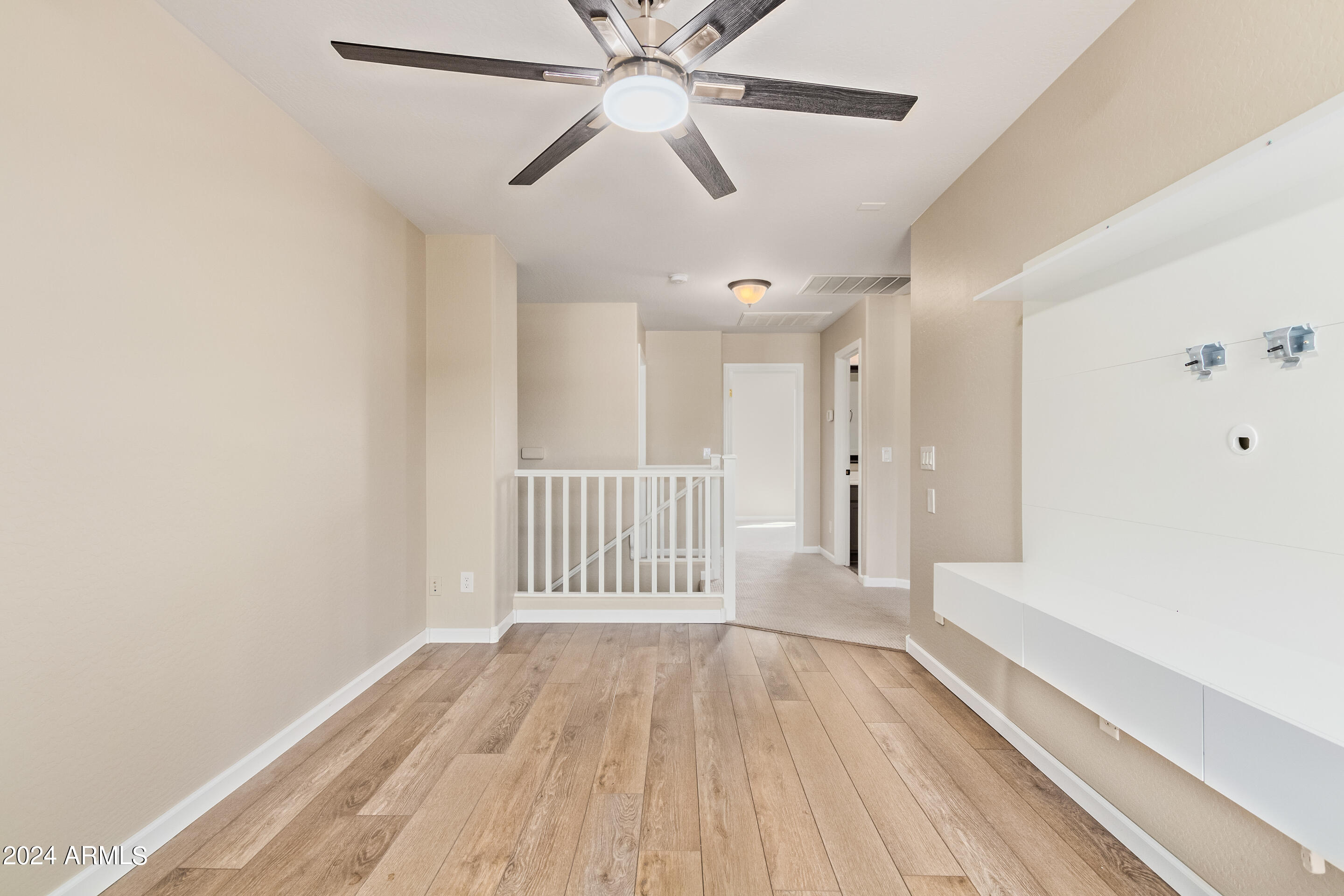 17149 West Rimrock Street Surprise, AZ 85388 - Photo 26 of 46 wooden floor in an empty room with a window
