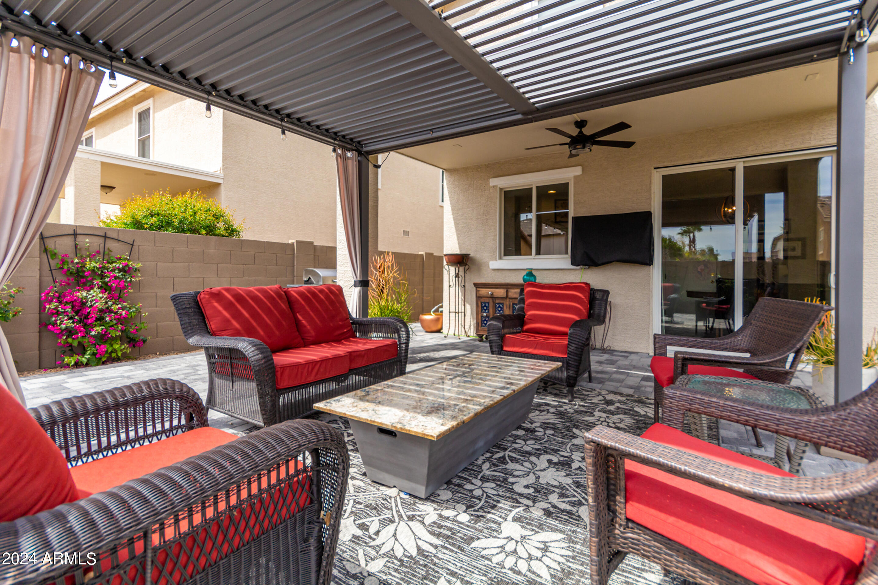 17149 West Rimrock Street Surprise, AZ 85388 - Photo 33 of 46 a outdoor living space with patio furniture and a potted plant