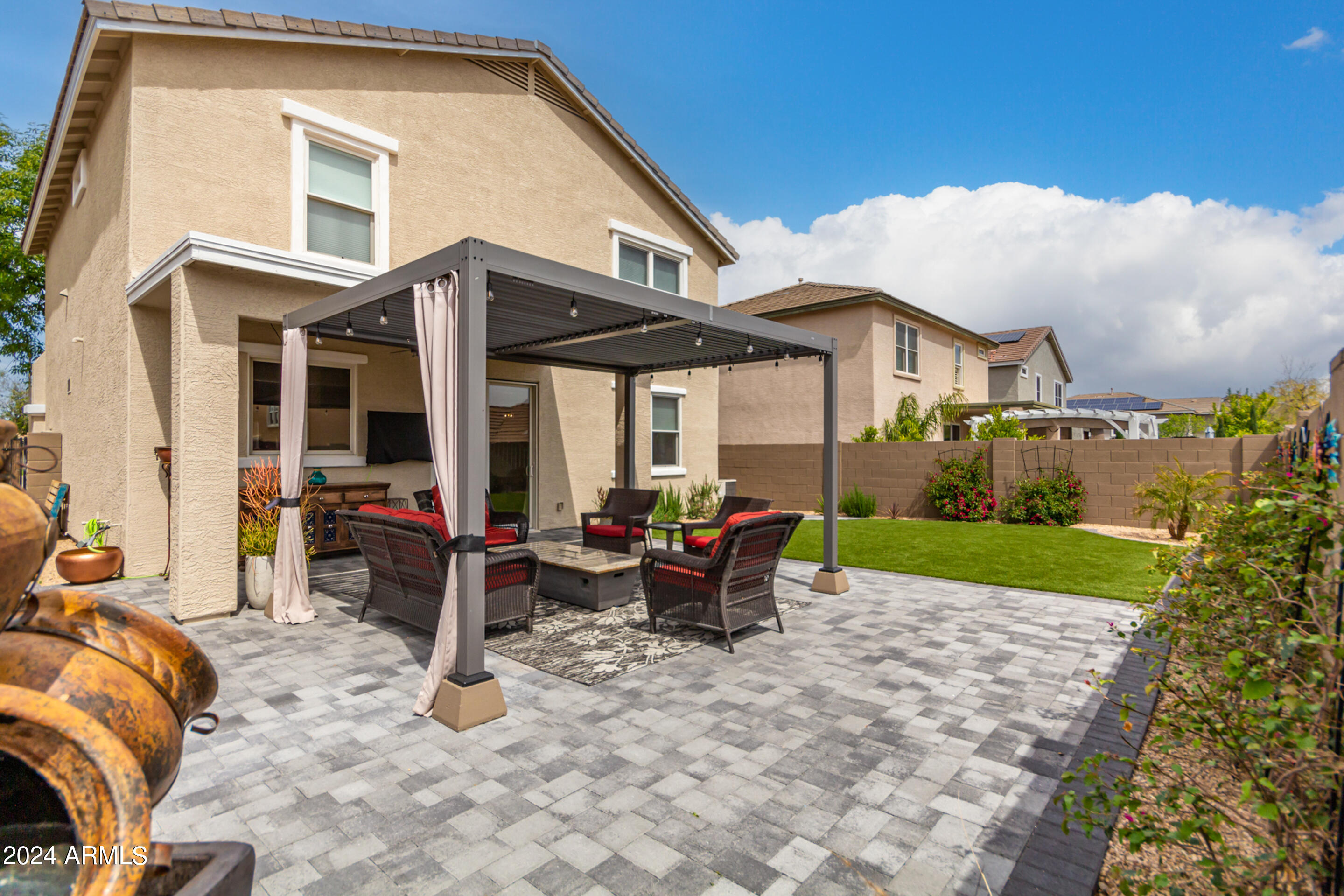 17149 West Rimrock Street Surprise, AZ 85388 - Photo 34 of 46 a view of a house with backyard porch and sitting area