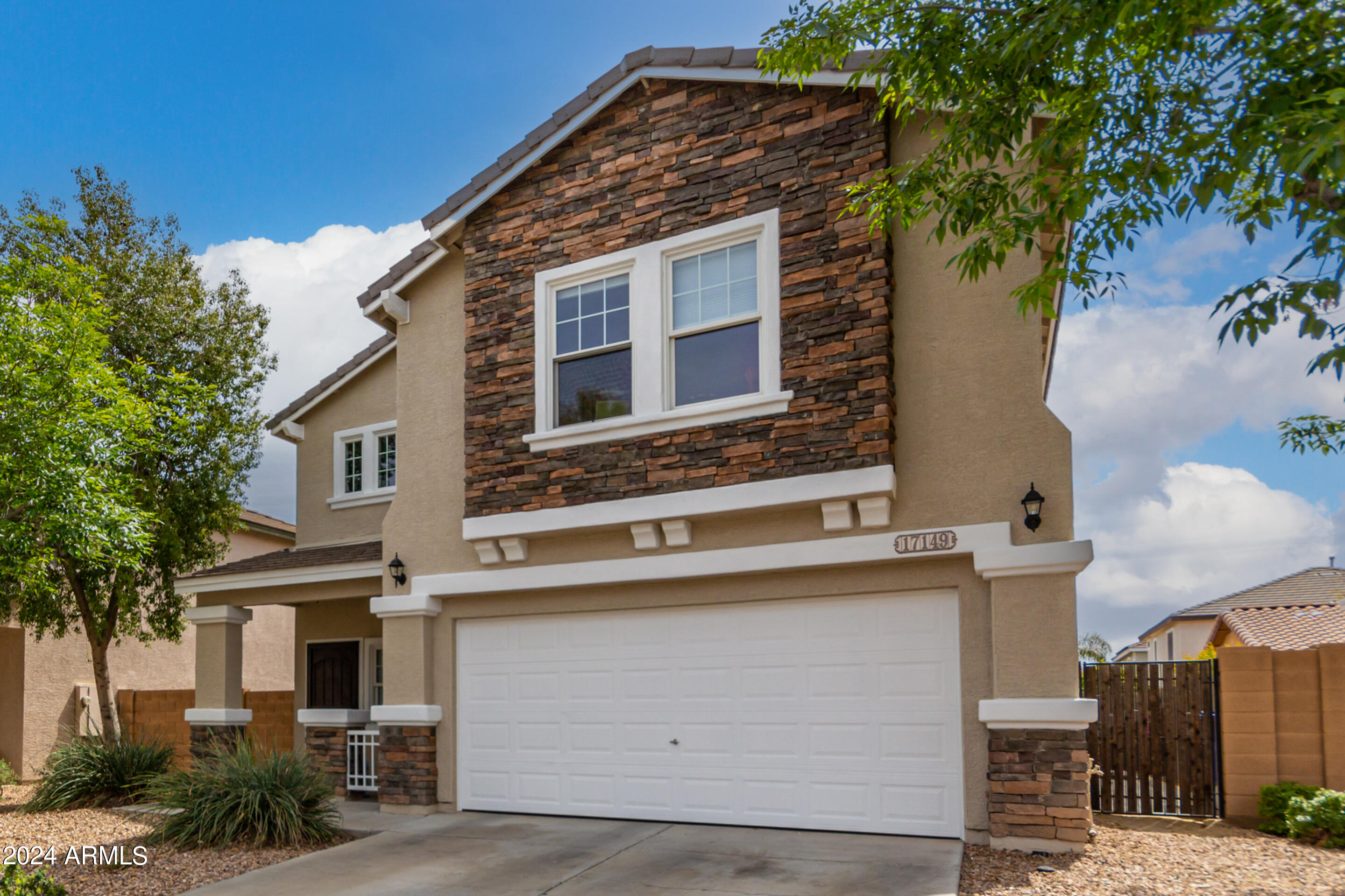17149 West Rimrock Street Surprise, AZ 85388 - Photo 4 of 46 a view of a house with a yard