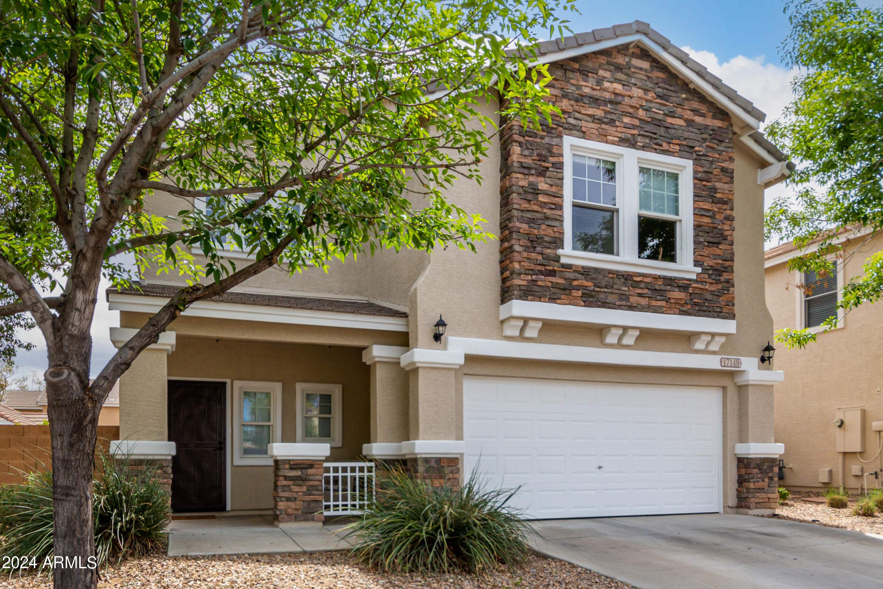 17149 West Rimrock Street Surprise, AZ 85388 - Photo 6 of 46 front view of house with a small yard