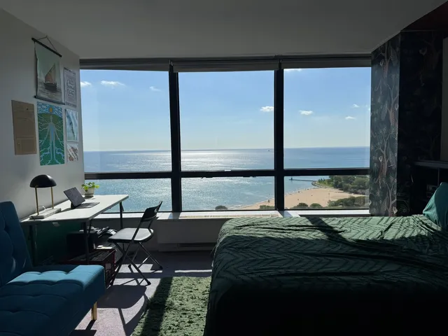 a white toilet sitting next to a bathroom sink and vanity