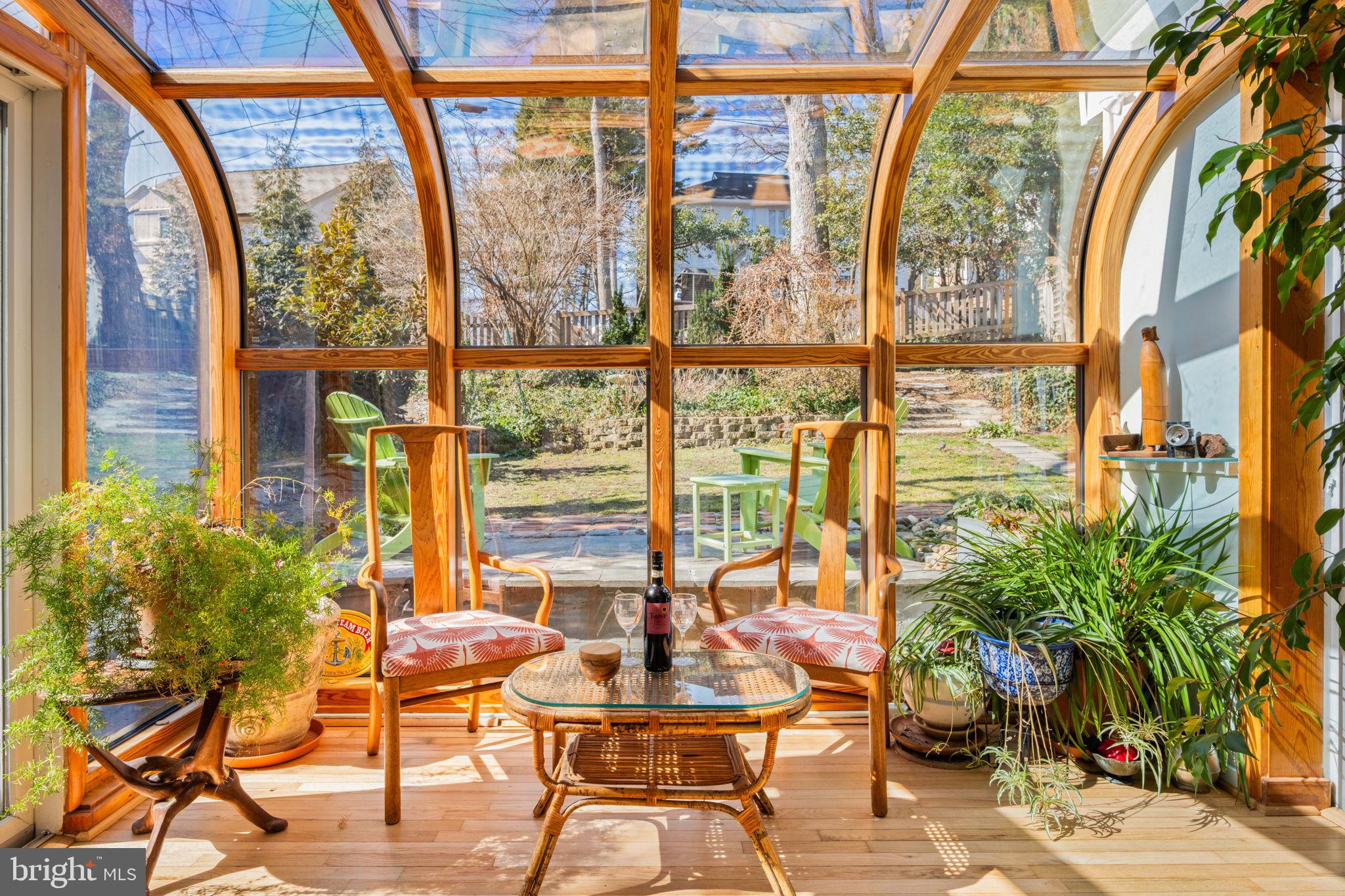 2904 Russell Road Alexandria, VA 22305 - Photo 10 of 52 a view of an empty room with floor to ceiling windows and potted plants