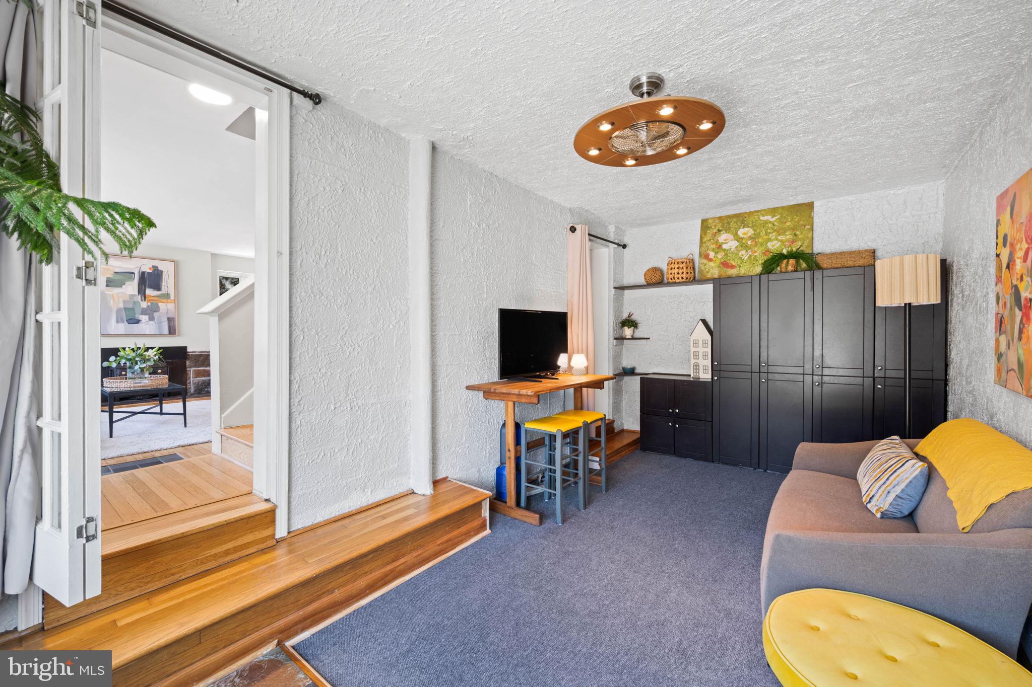 2904 Russell Road Alexandria, VA 22305 - Photo 20 of 52 a living room with furniture and a flat screen tv