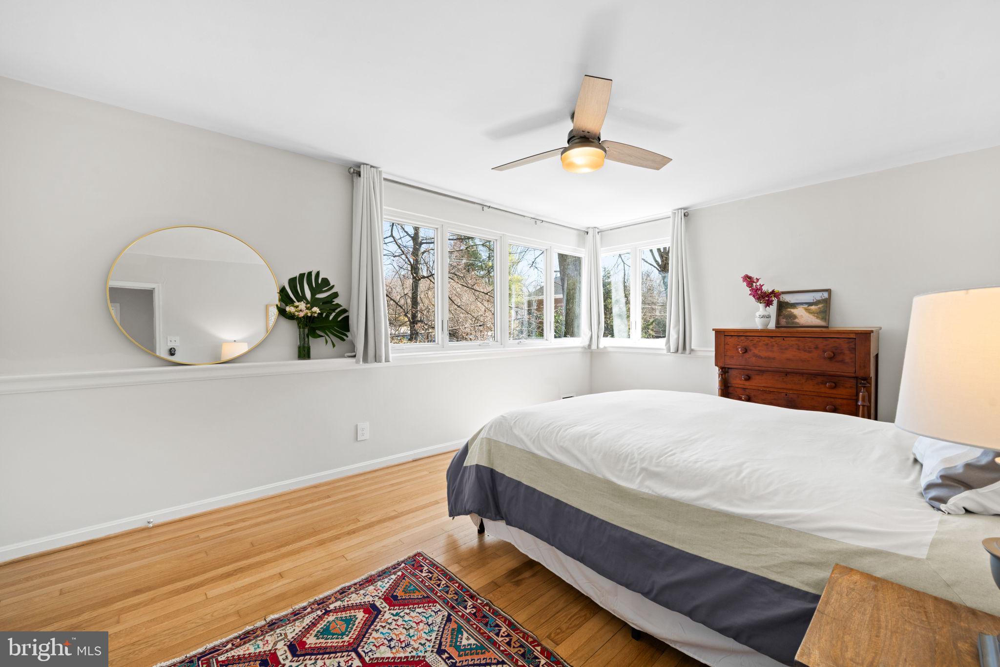 2904 Russell Road Alexandria, VA 22305 - Photo 22 of 52 a bedroom with a bed and a chandelier