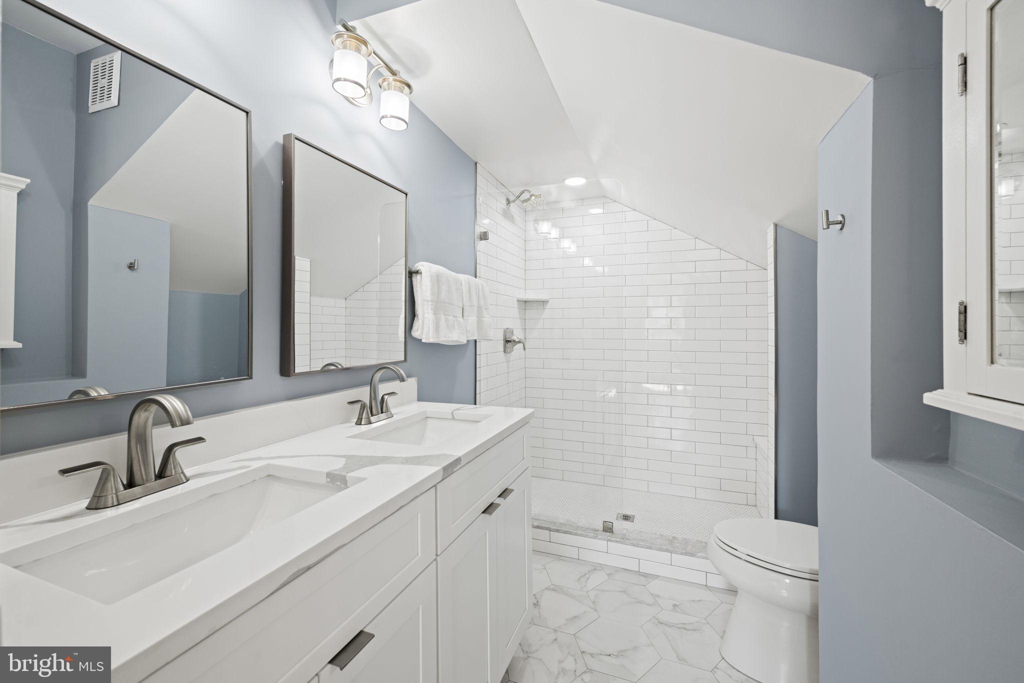 2904 Russell Road Alexandria, VA 22305 - Photo 26 of 52 a bathroom with a sink a toilet and shower