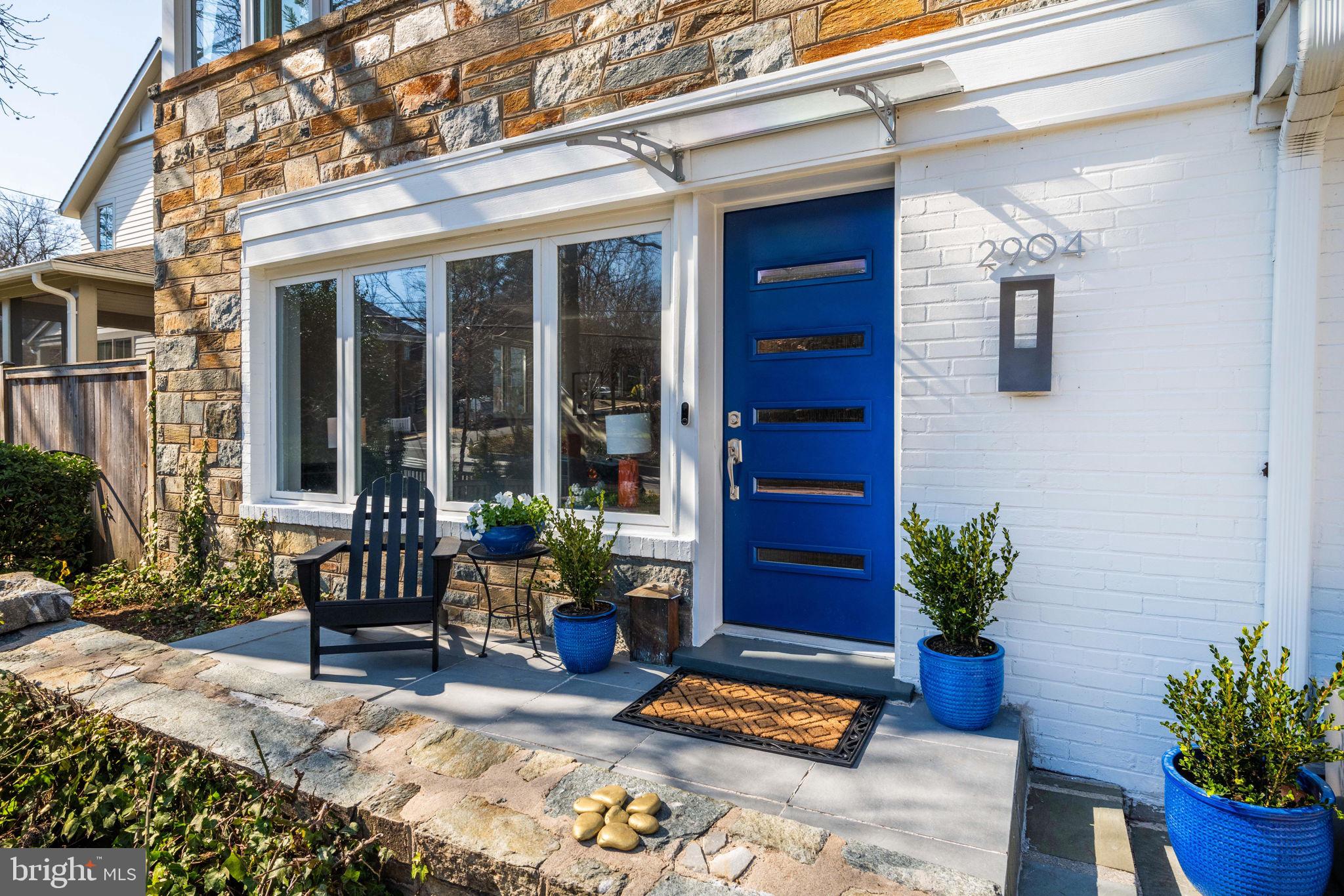 2904 Russell Road Alexandria, VA 22305 - Photo 2 of 52 a building outdoor space with potted plants and furniture