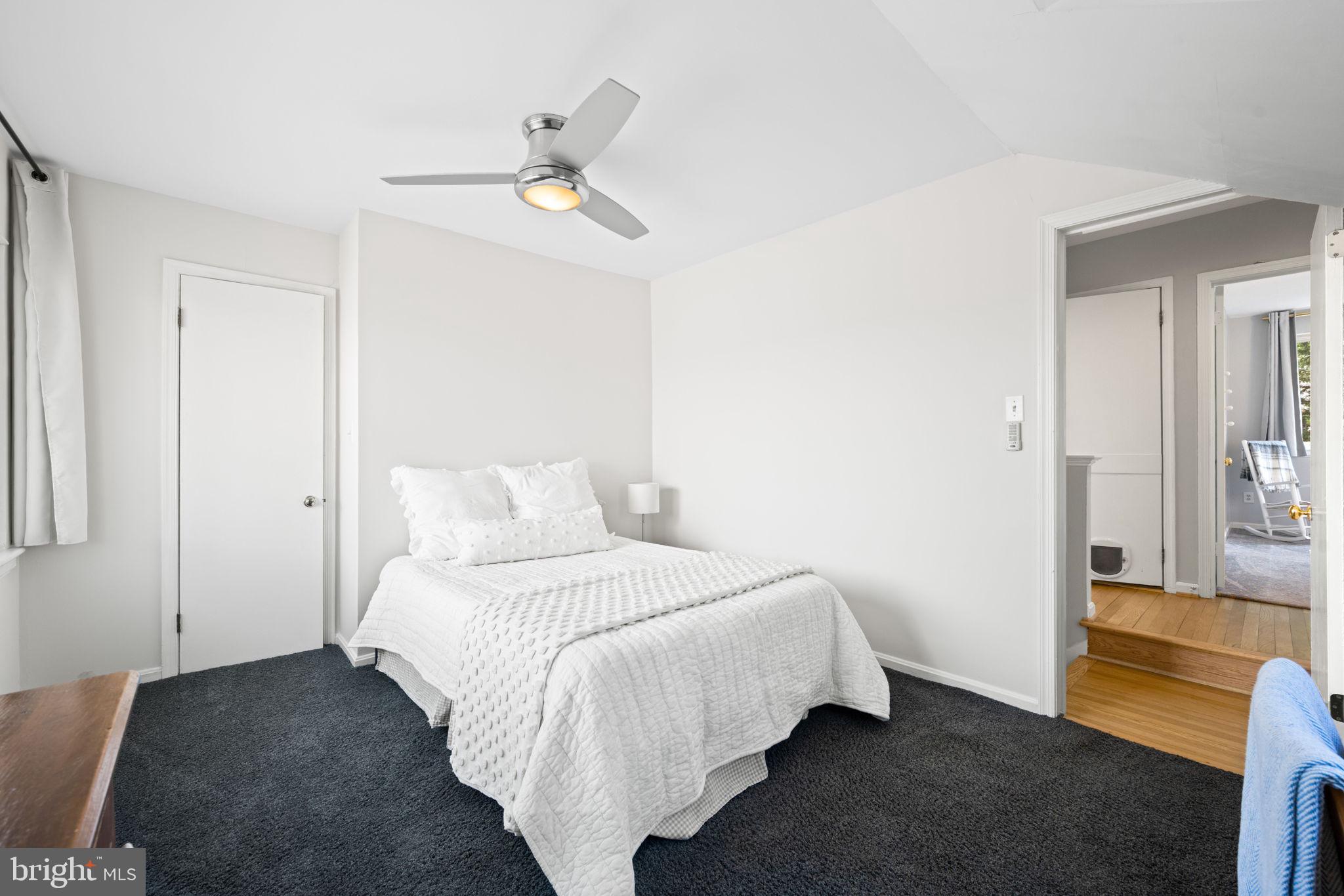 2904 Russell Road Alexandria, VA 22305 - Photo 31 of 52 a bedroom with a bed and a chandelier