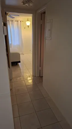 a bathroom with a glass door shower and a sink