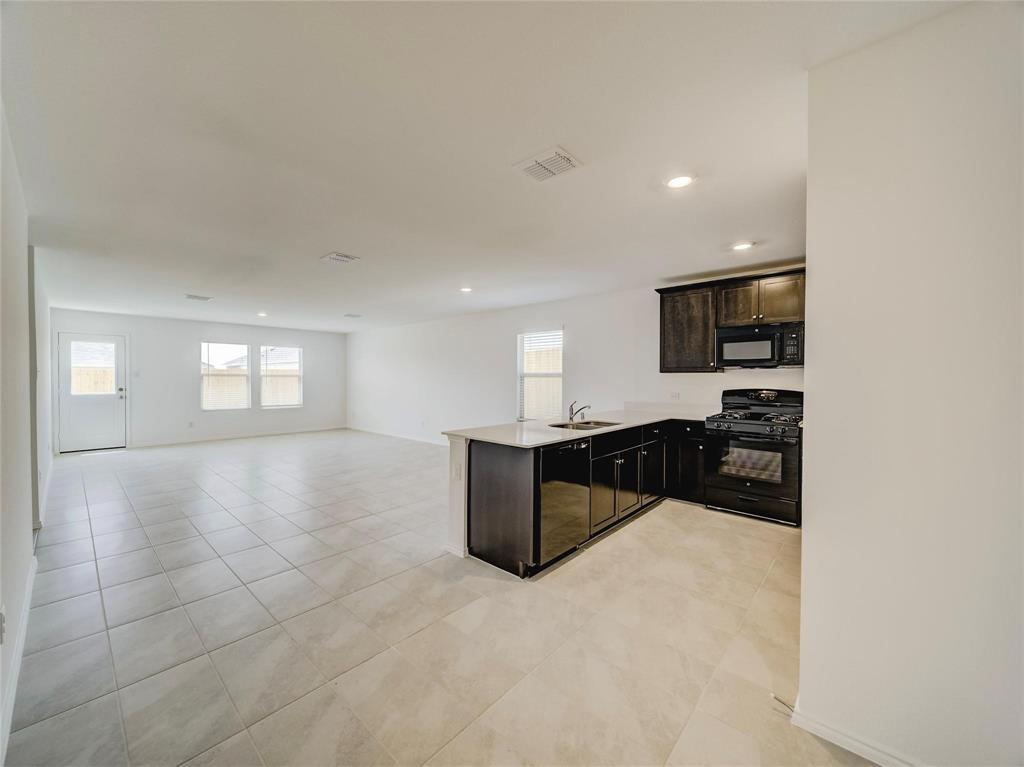 357 Sun Bluff Road Fort Worth, TX 76052 - Photo 9 of 35 Open-concept interior featuring light-toned tile flooring throughout