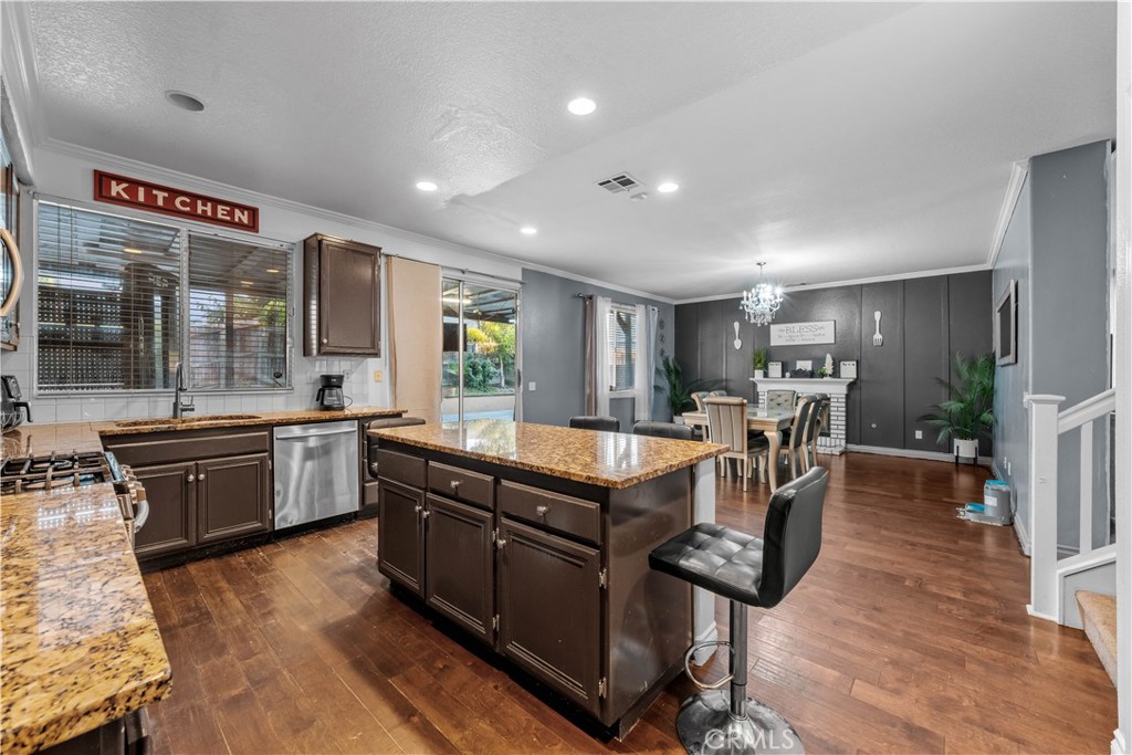 3807 Seattle Street Hemet, CA 92545 - Photo 13 of 38 a large kitchen with stainless steel appliances lots of counter top space