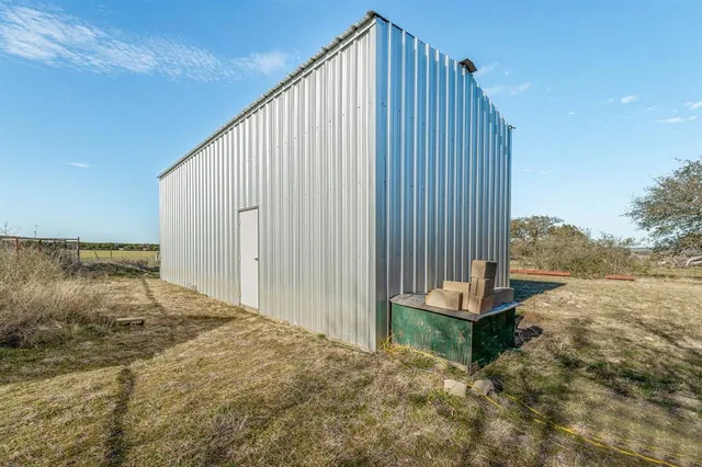 a view of a backyard with hardwood
