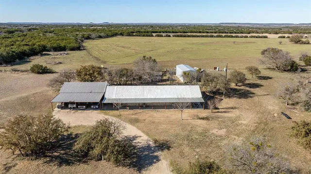a view of a lake with houses in the back