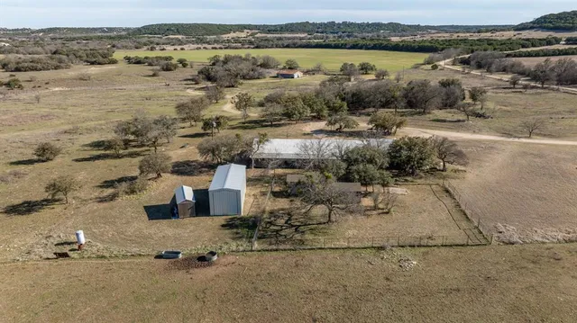 an aerial view of a houses with ocean view