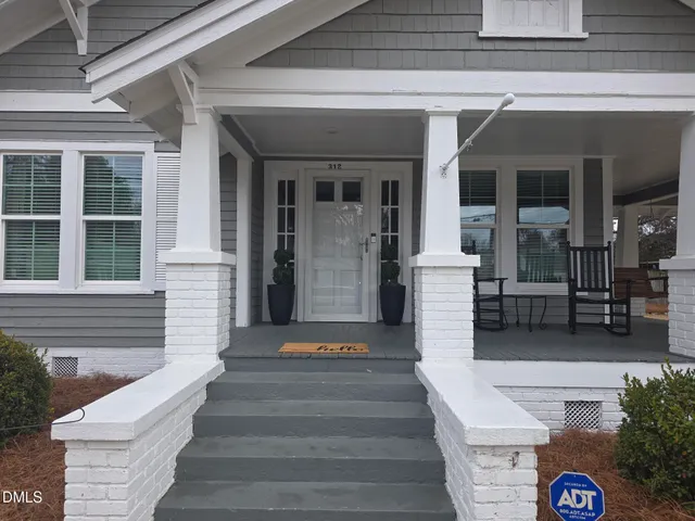 a front view of a house with stairs