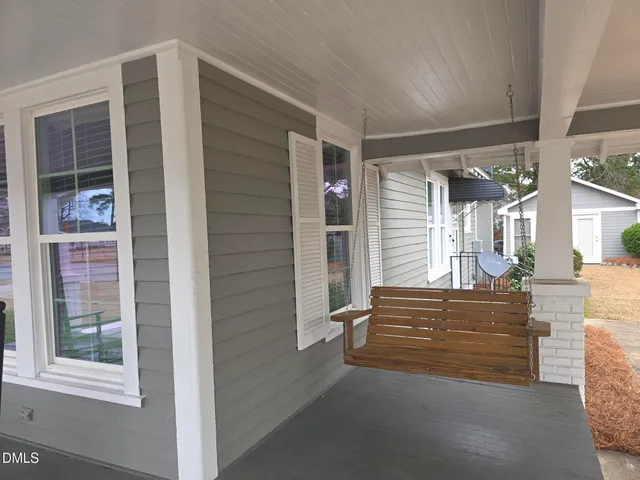 a view of front door with chair and front door