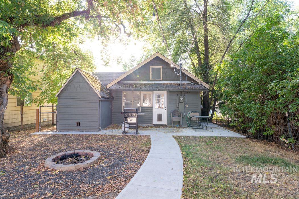 112 South Asbury Street Moscow, ID 83843 - Photo 18 of 26 Rear view of house featuring a patio and an outdoor fire pit