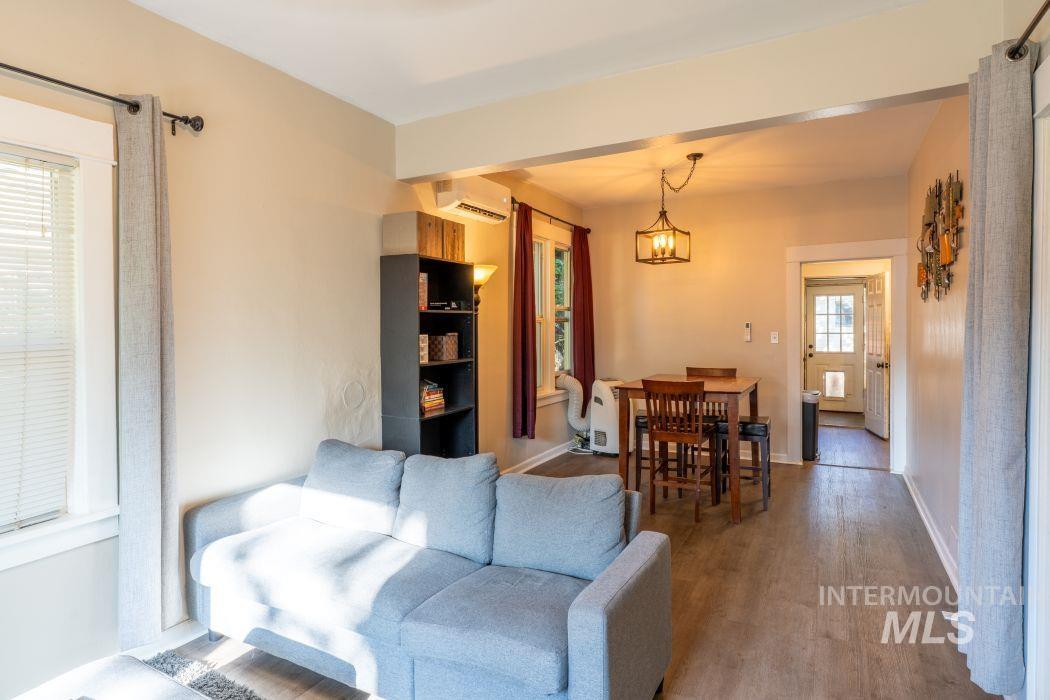 112 South Asbury Street Moscow, ID 83843 - Photo 2 of 26 Living room with wood finished floors and a wall unit AC